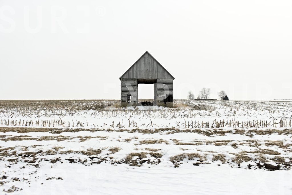 Open barn, snowy field, Midwest