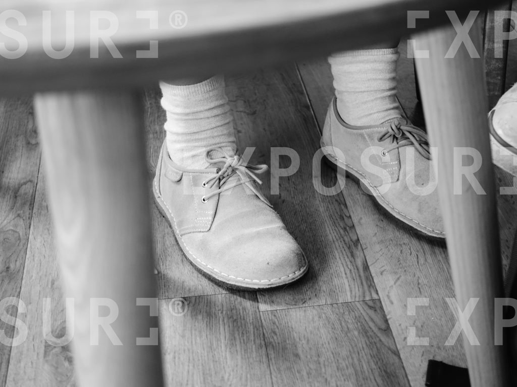 Feet under a chair