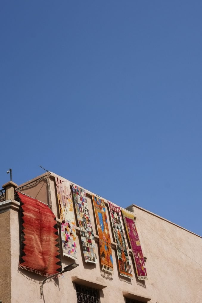 Bright coloured rugs on a rooftop in Morocco