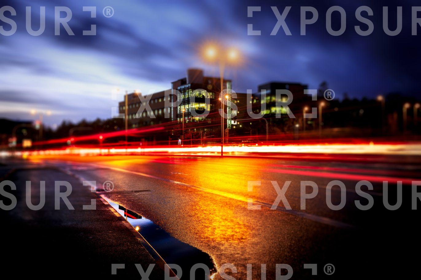 Corporate Building And Reflection In City At Night