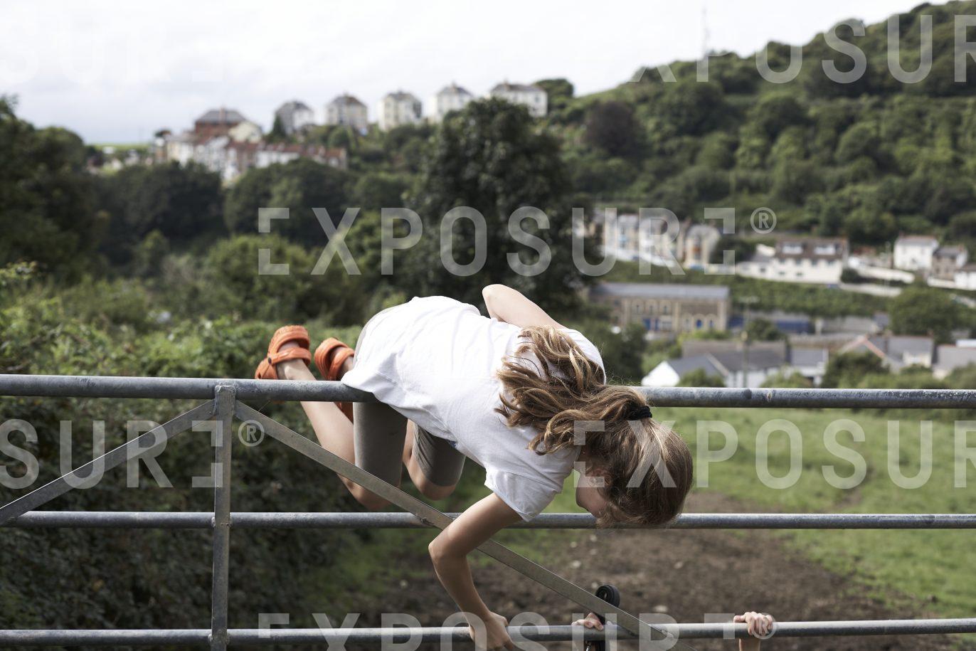 Devon, girl vaults farm gate
