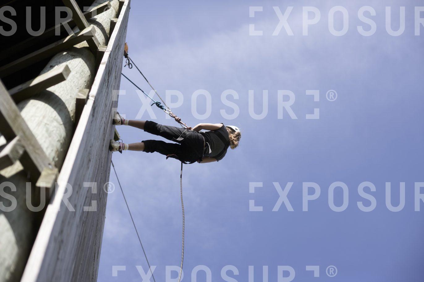 Young girl abseiling