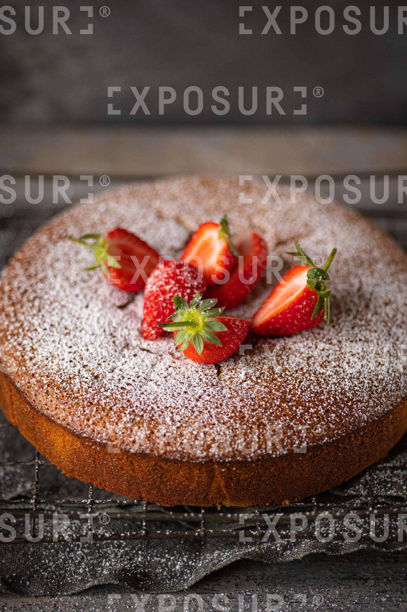 Pistachio, polenta and olive oil cake with strawberries