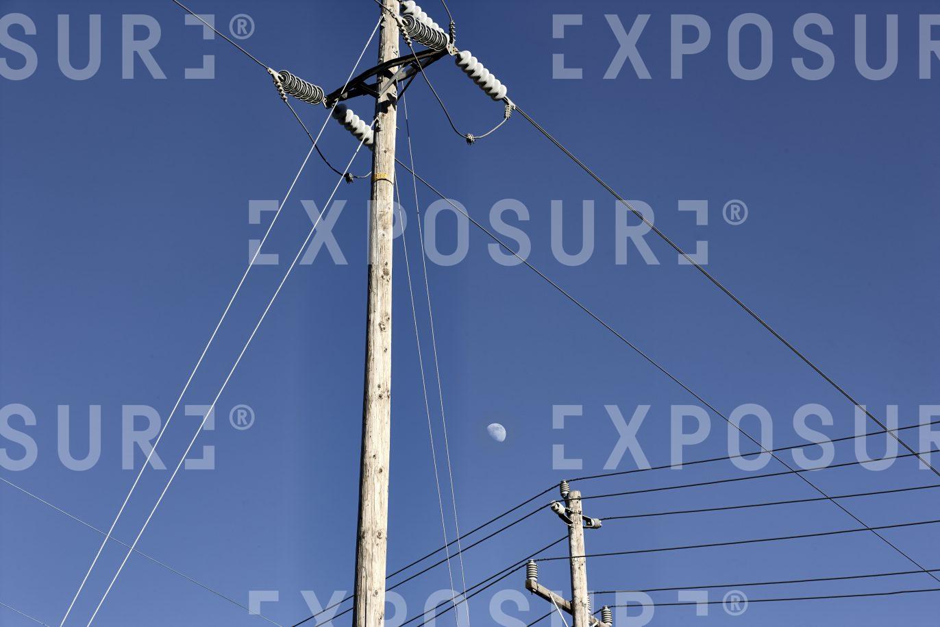 Power lines and moon