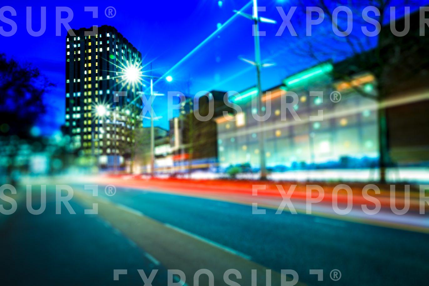 Busy City At Night With Office Block