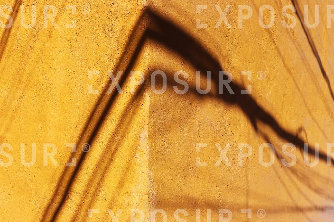 Shadows on a Yellow Wall