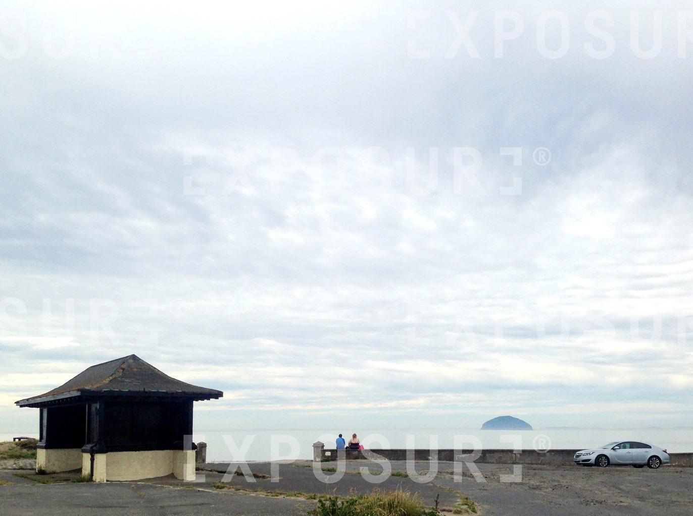 Couple watching the sea in Girvan, Scotland