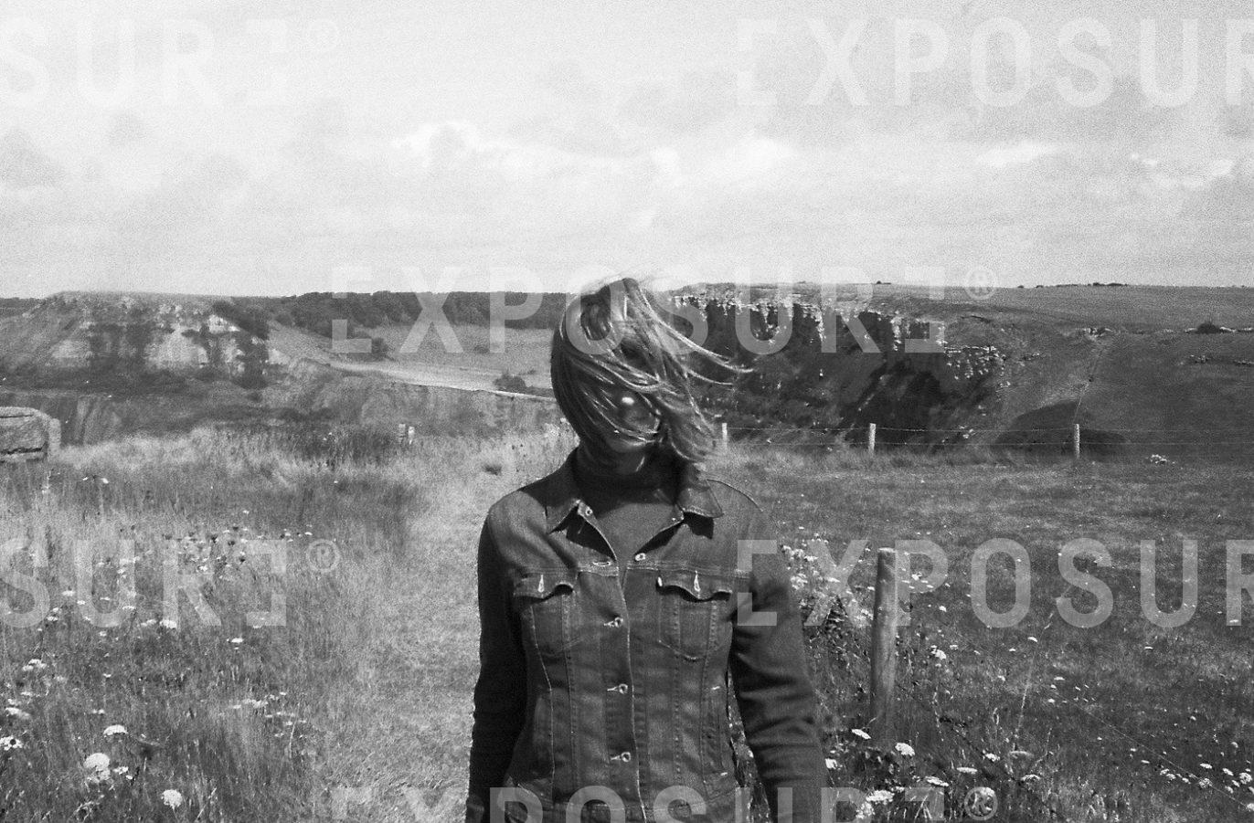 Woman concealed by hair.