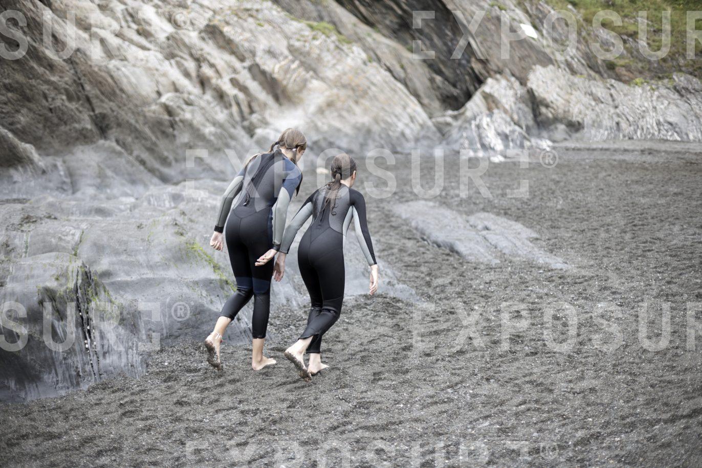 Devon, two girls in wetsuits