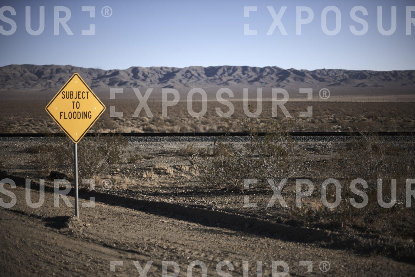 Ironic flood warning sign, California