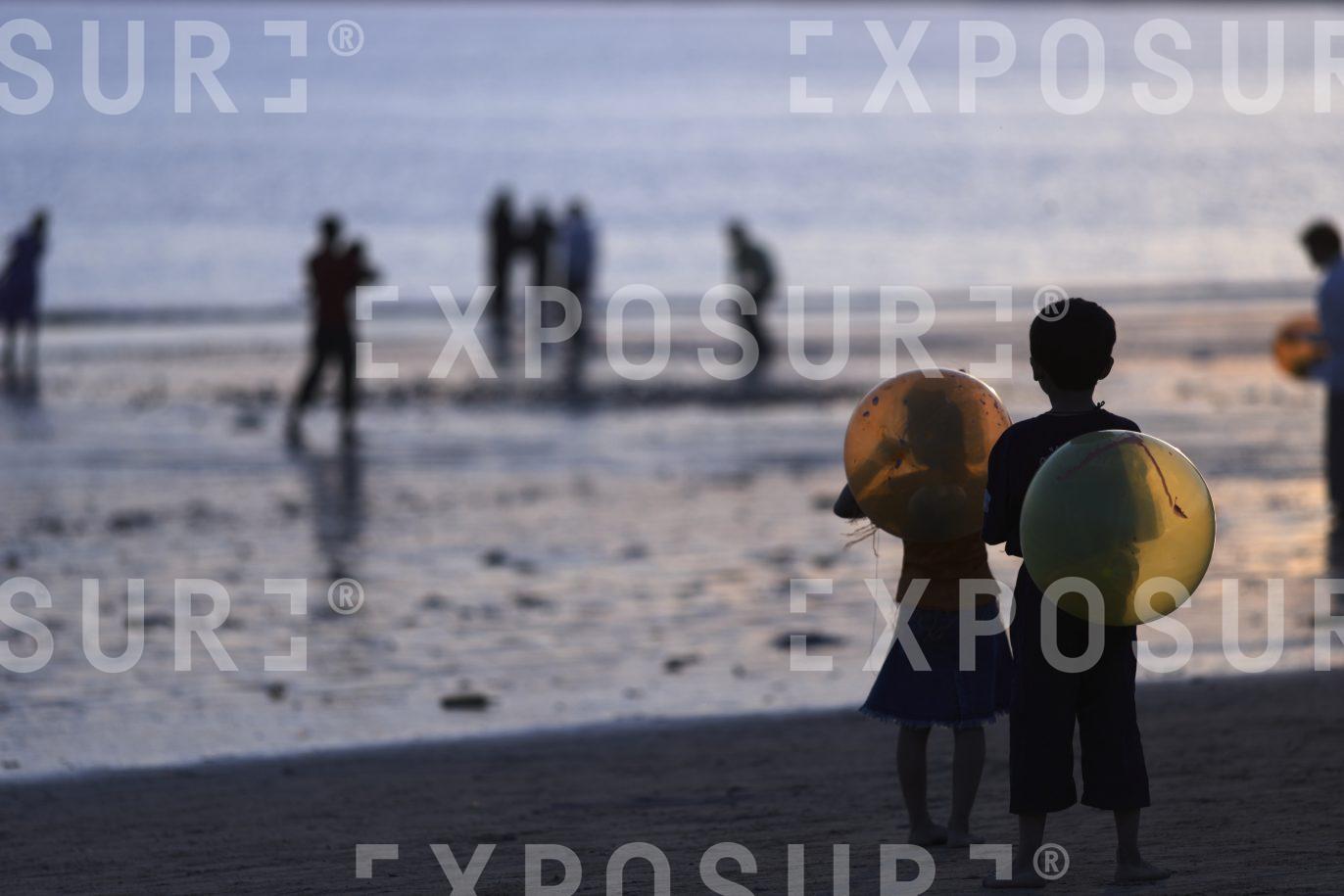 Children with balloons, Mumbai, India