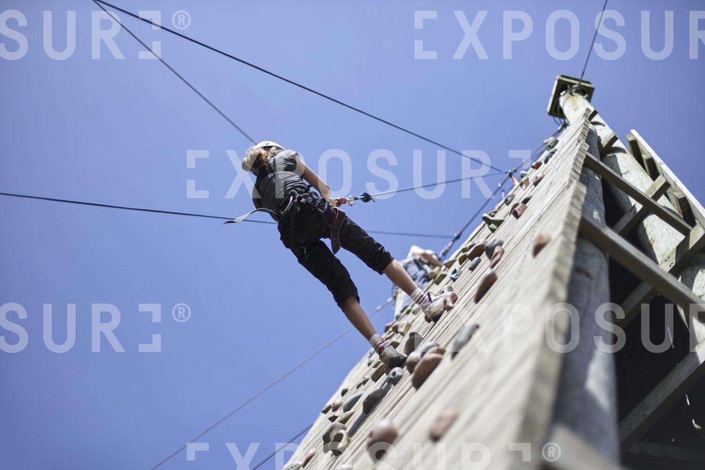Abseiling down a climbing wall