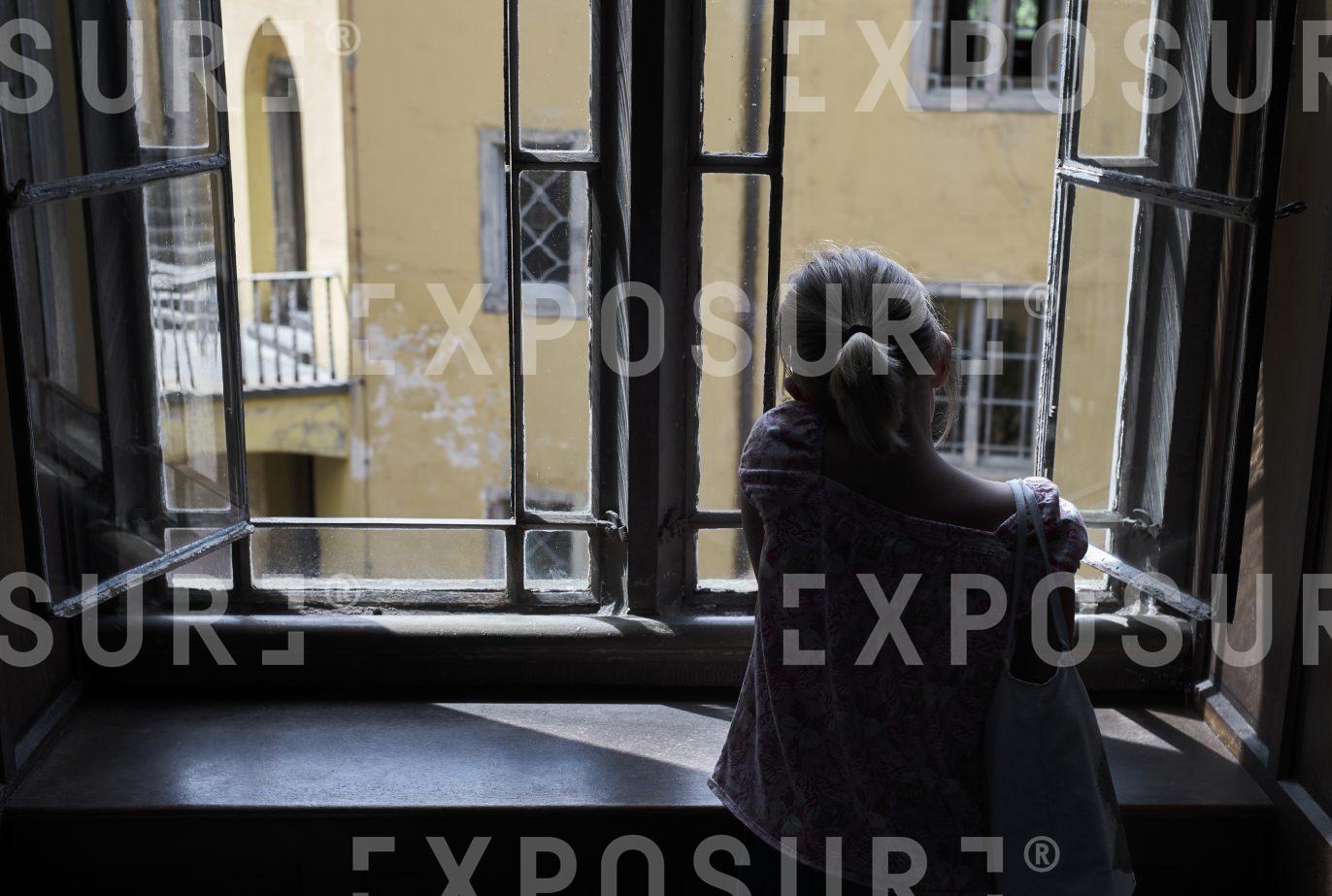 Child looking out of window