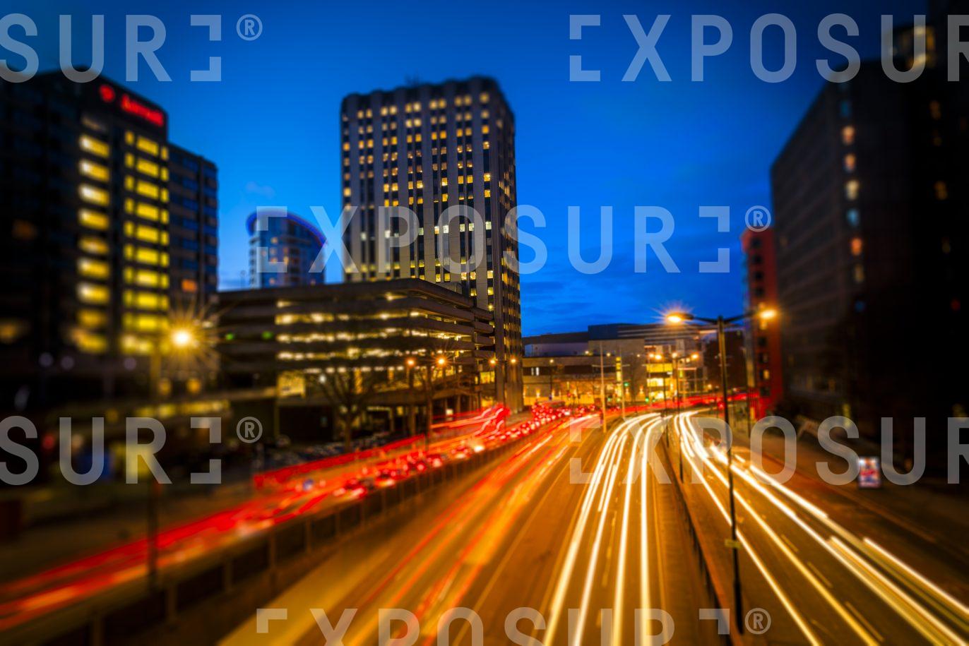 Elevated View Of City Centre Roads At Evening Rush Hour