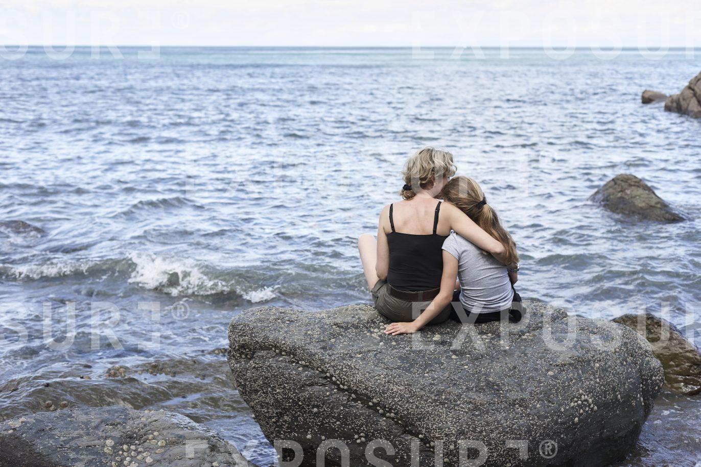 Devon, a mother comforts her daughter
