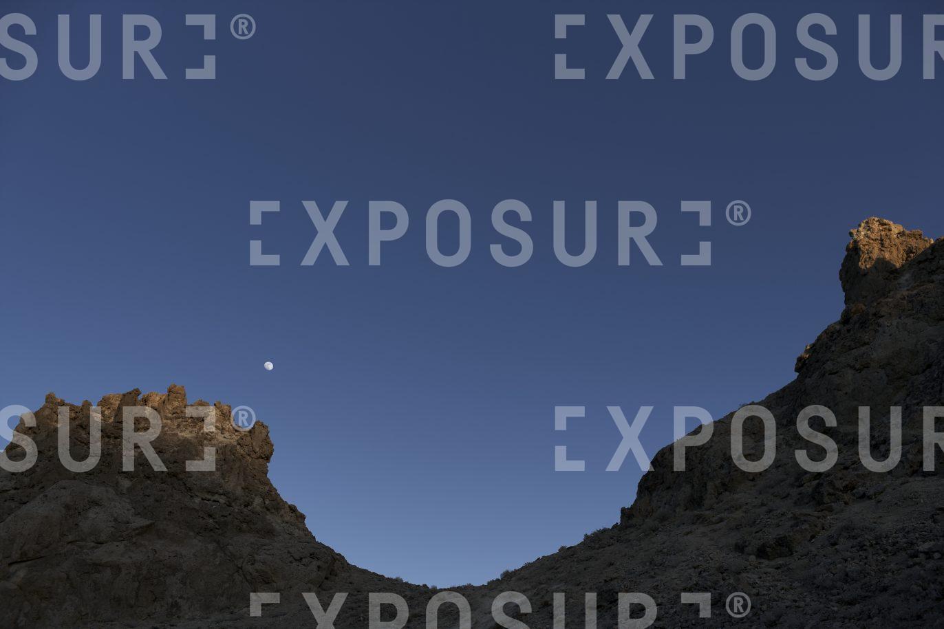 Rocky saddle and moon, California