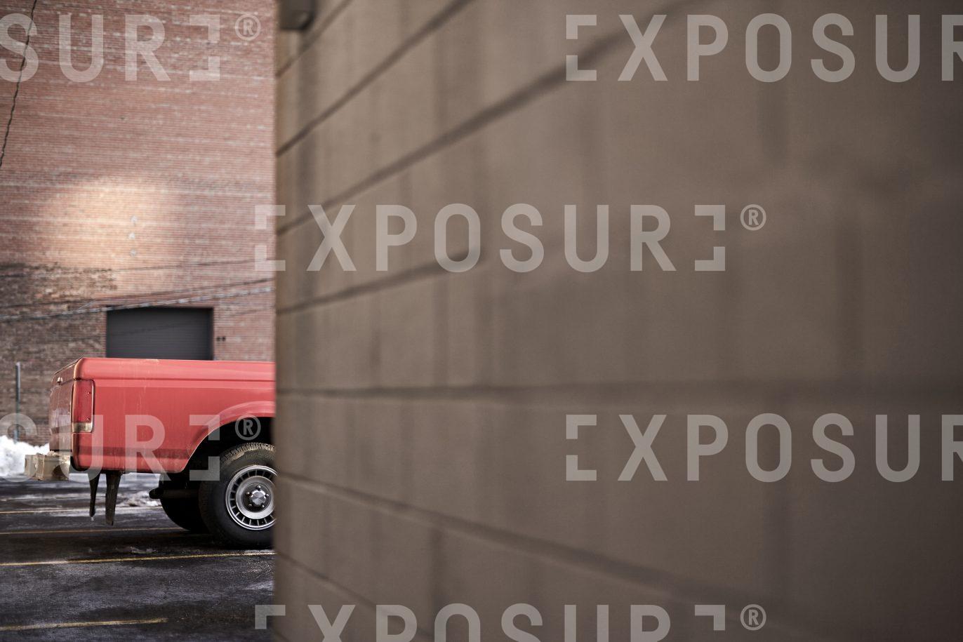 Red pickup truck parked, Midwest