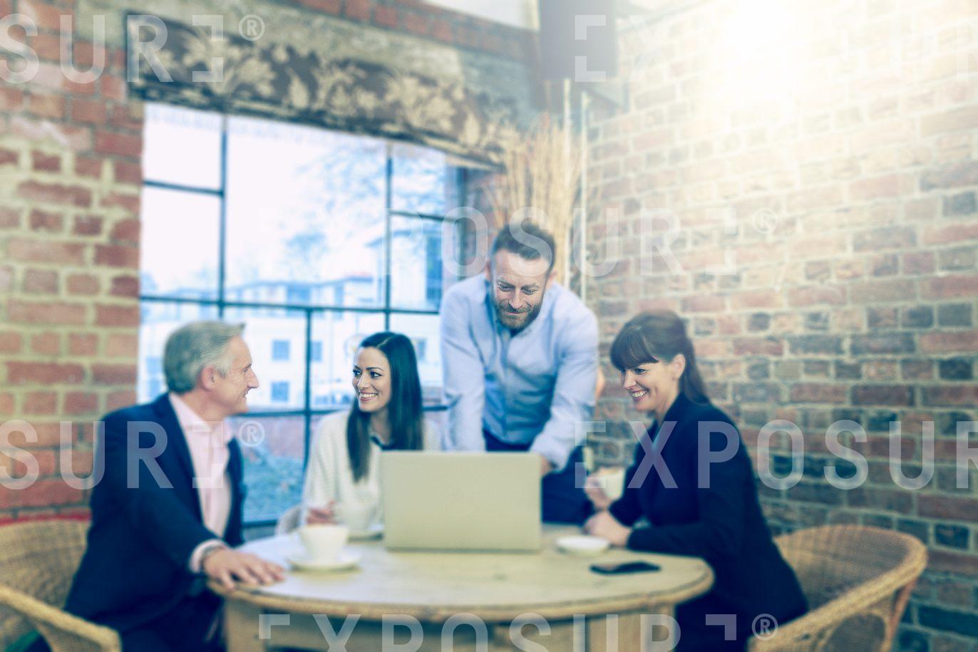 Group Remote Working In Cafe